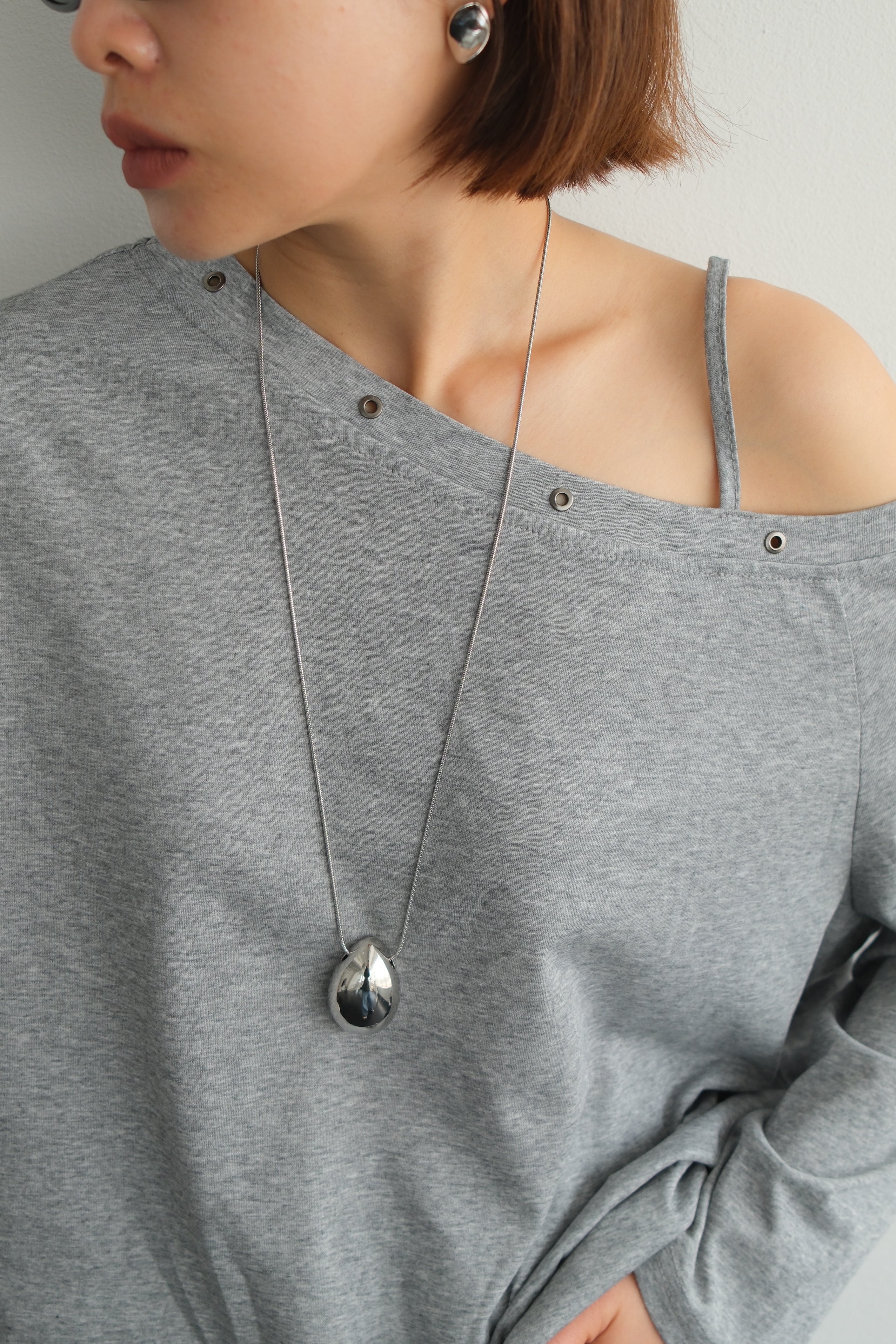 Asymmetric Shoulder Eyelet Top