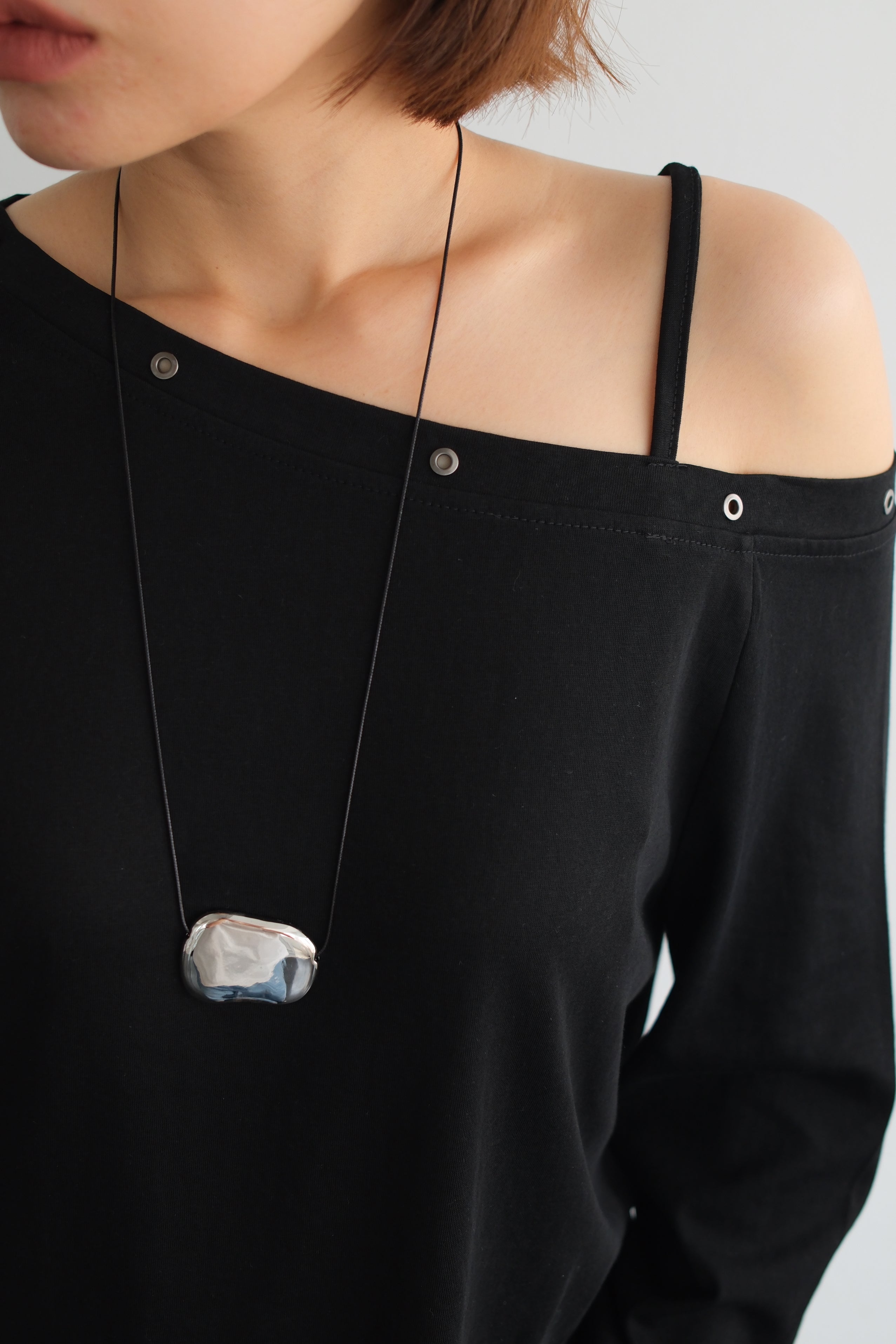 Asymmetric Shoulder Eyelet Top