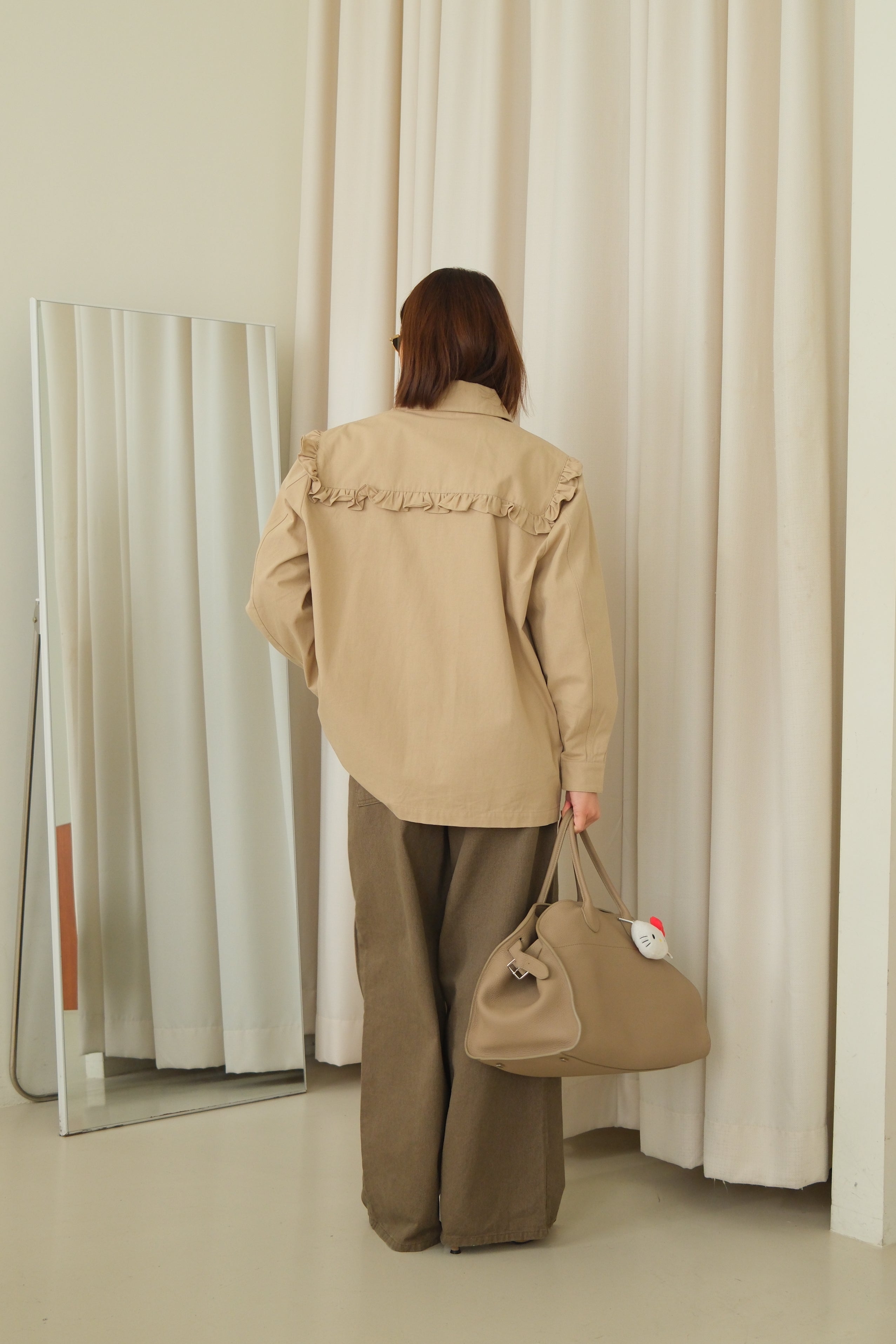 Frill jacket with removable pocket