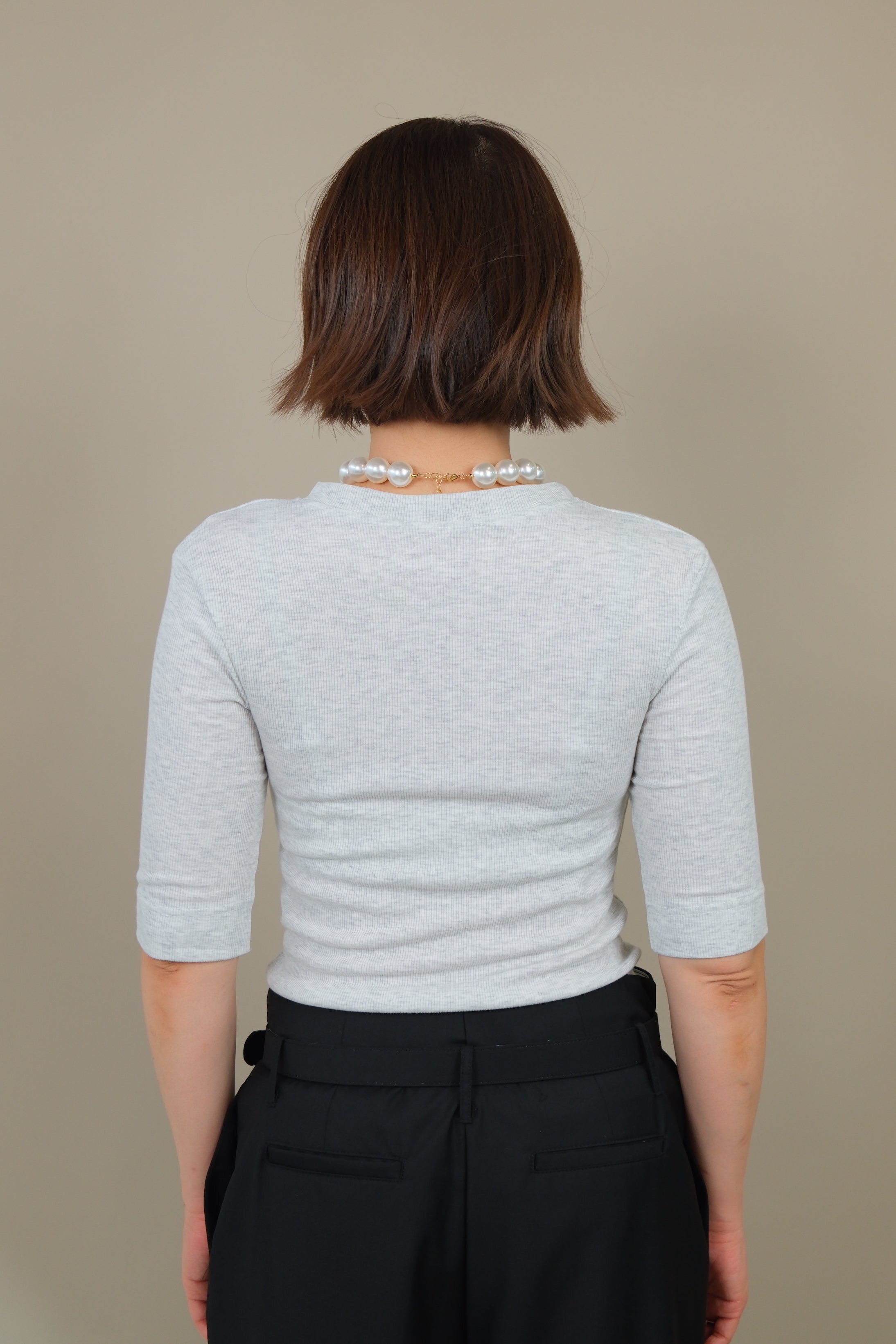 Messy buttoned cotton-ribbed top