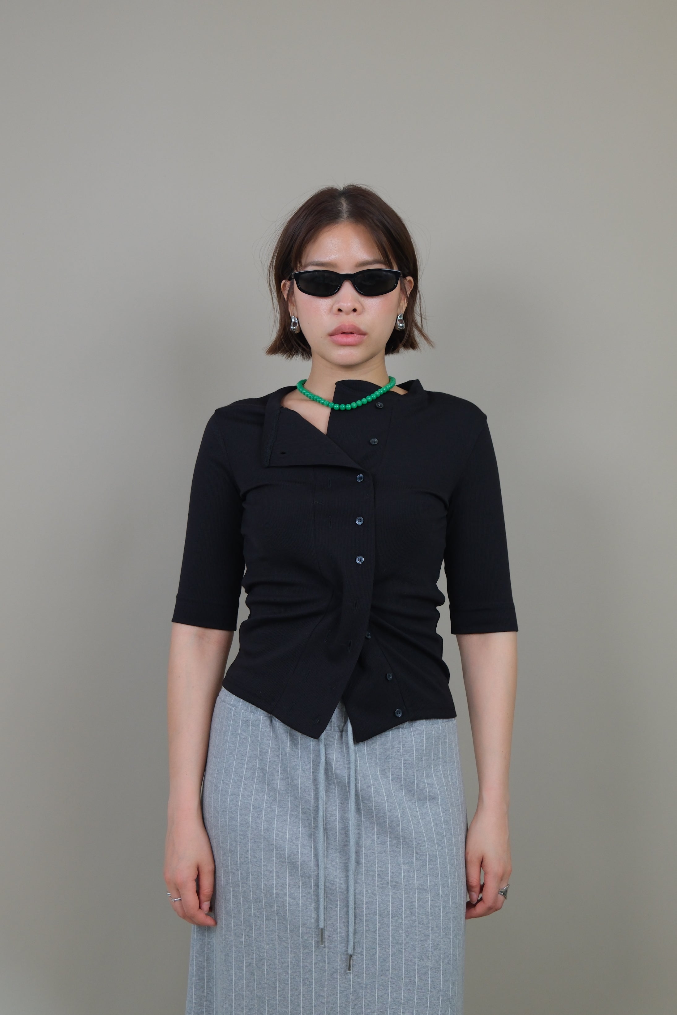 Messy buttoned cotton-ribbed top