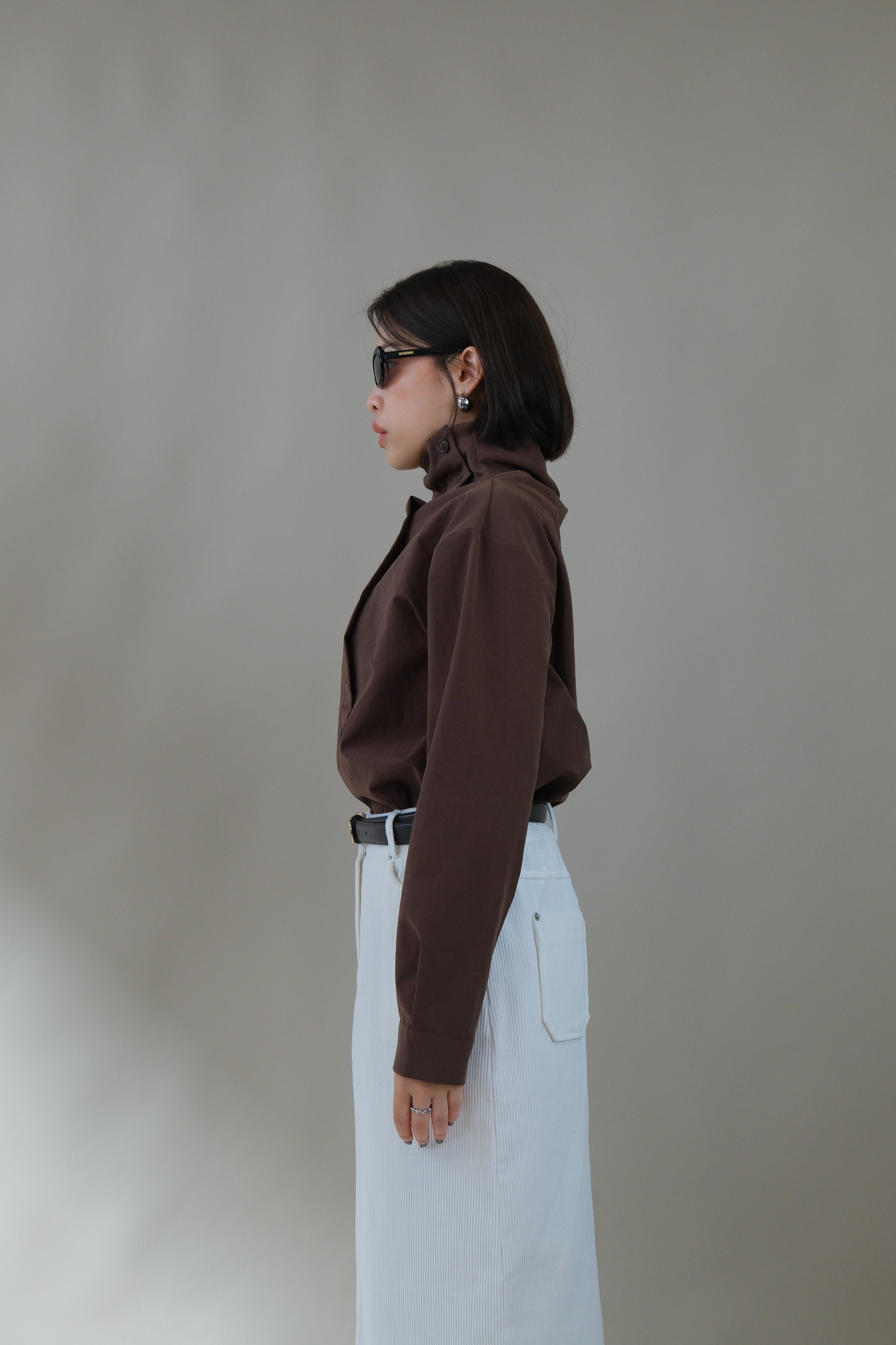 Funnel neck asym button blouse