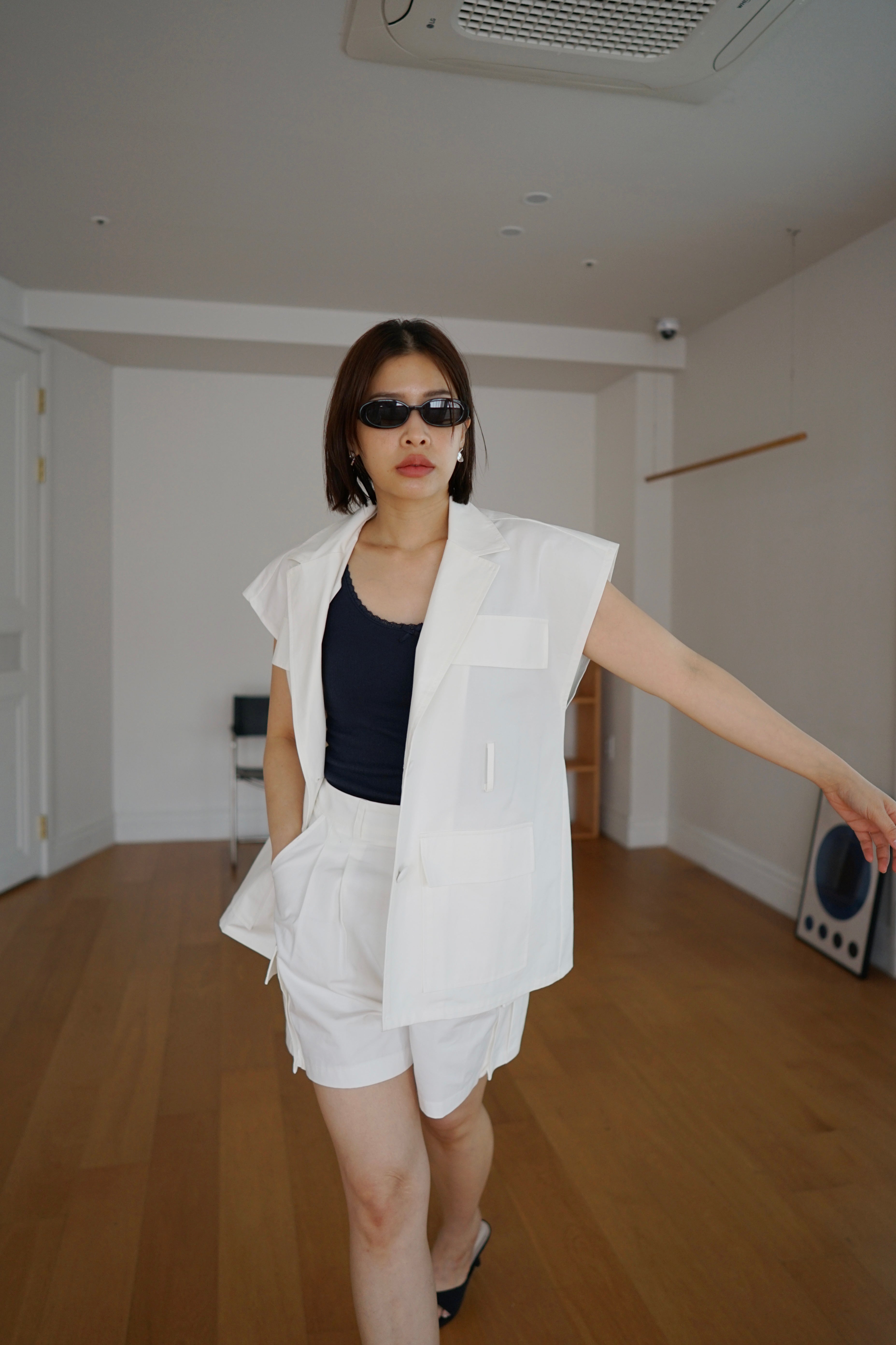 Roma sleeveless jacket with belt