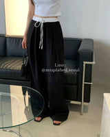 elasticated waistband pleated trousers
