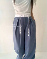 elasticated waistband pleated trousers