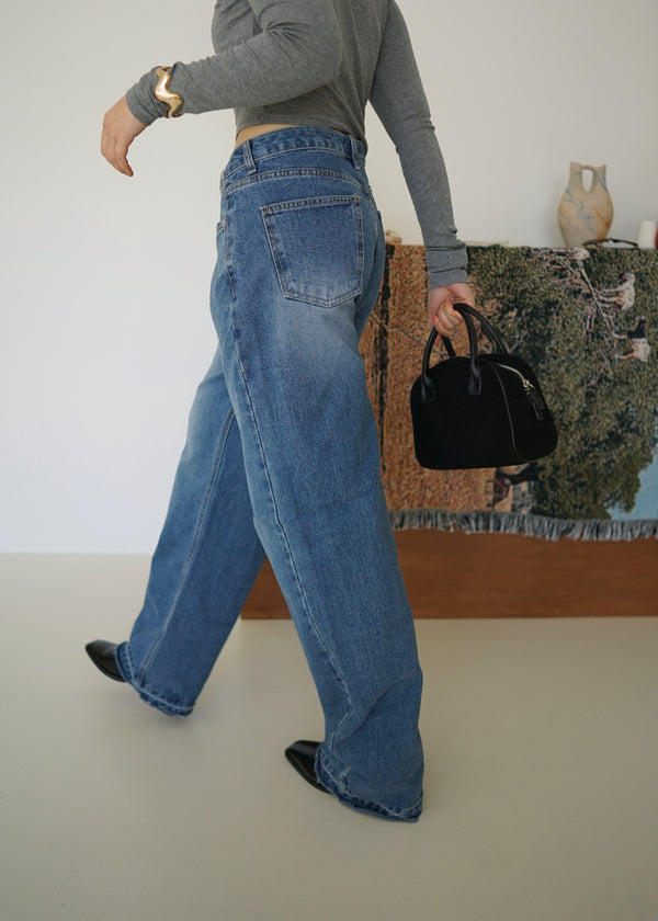 Frayed hem crossover jeans