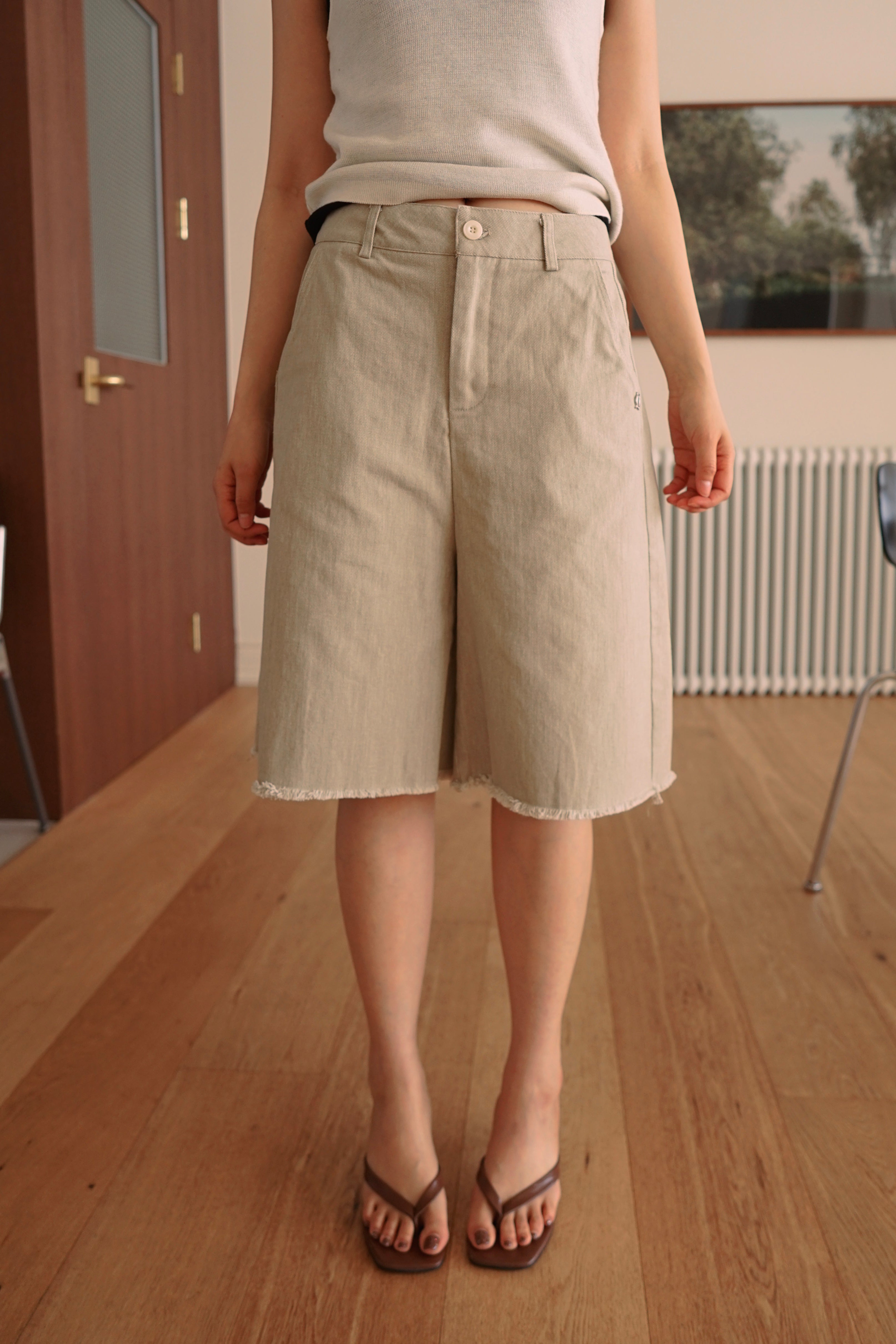 Relaxed fit denim bermuda shorts with frayed hem