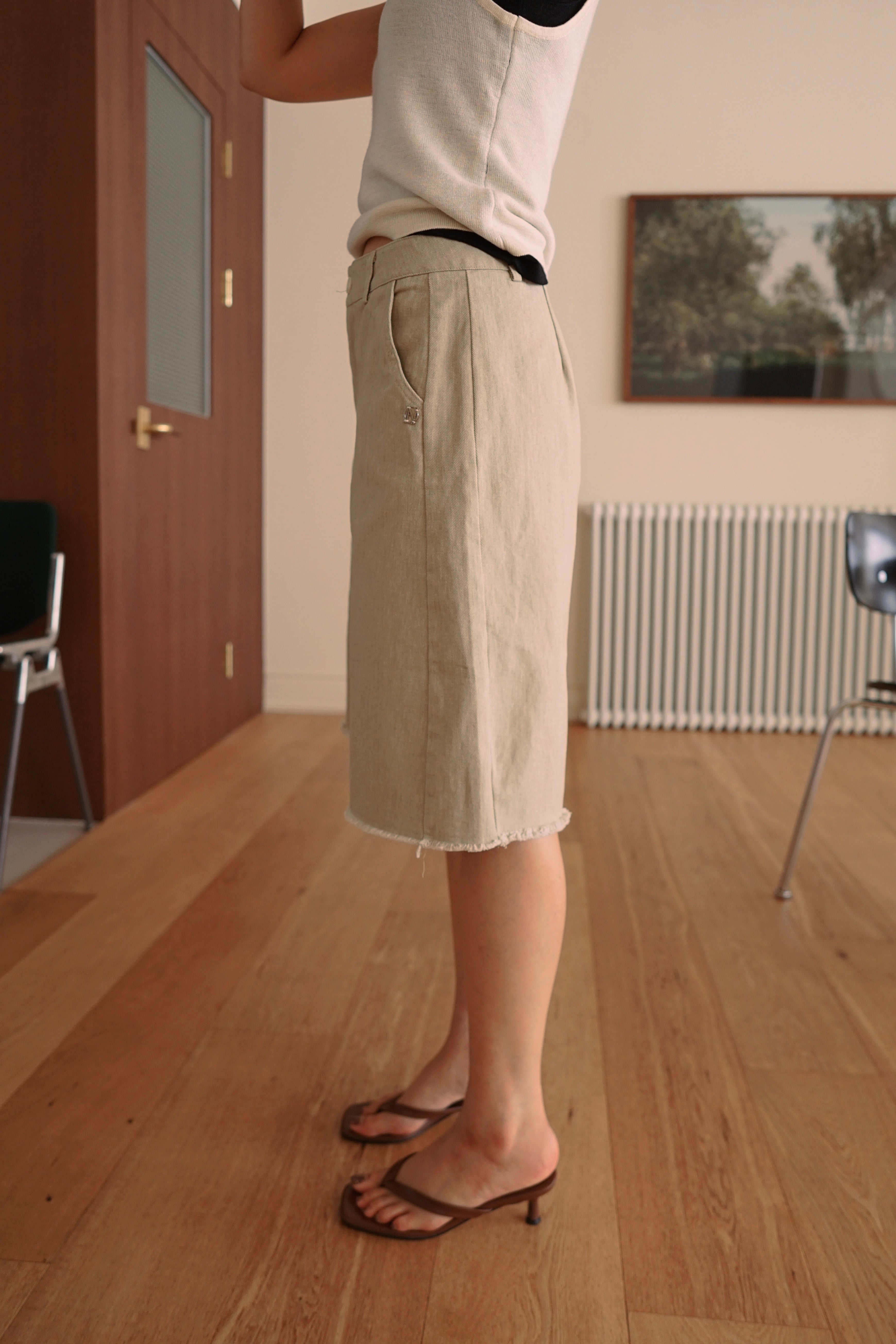 Relaxed fit denim bermuda shorts with frayed hem
