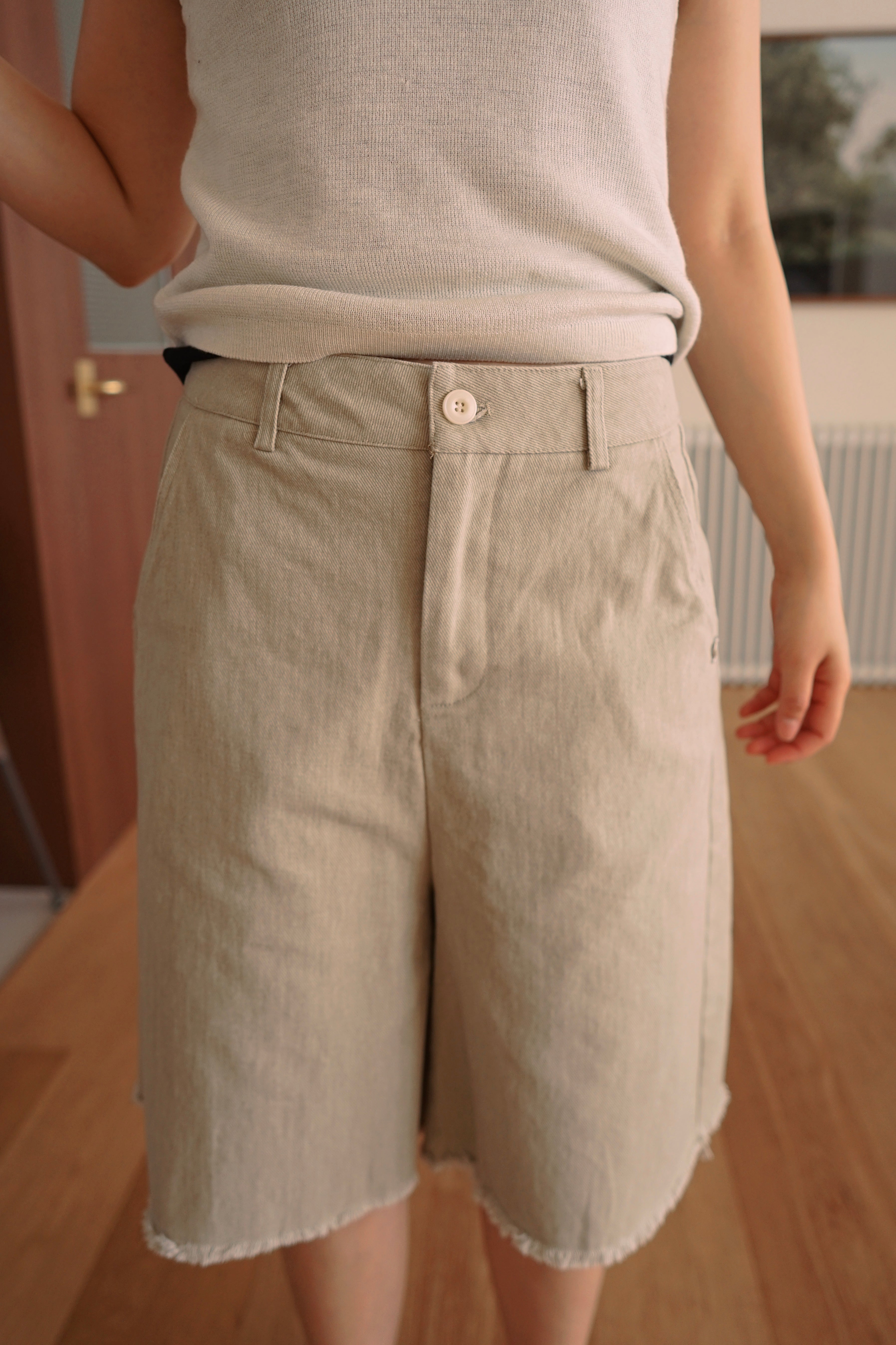 Relaxed fit denim bermuda shorts with frayed hem