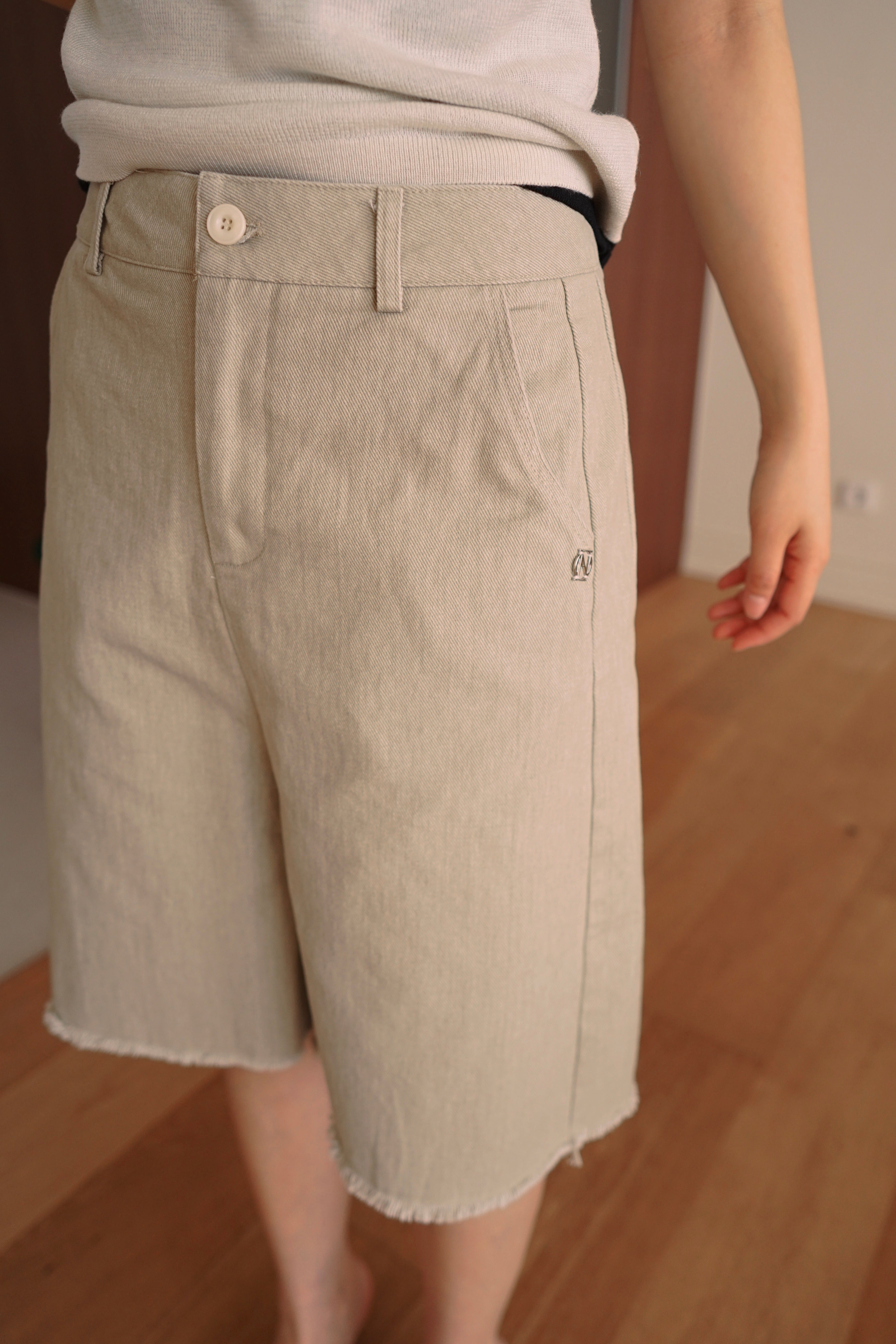 Relaxed fit denim bermuda shorts with frayed hem
