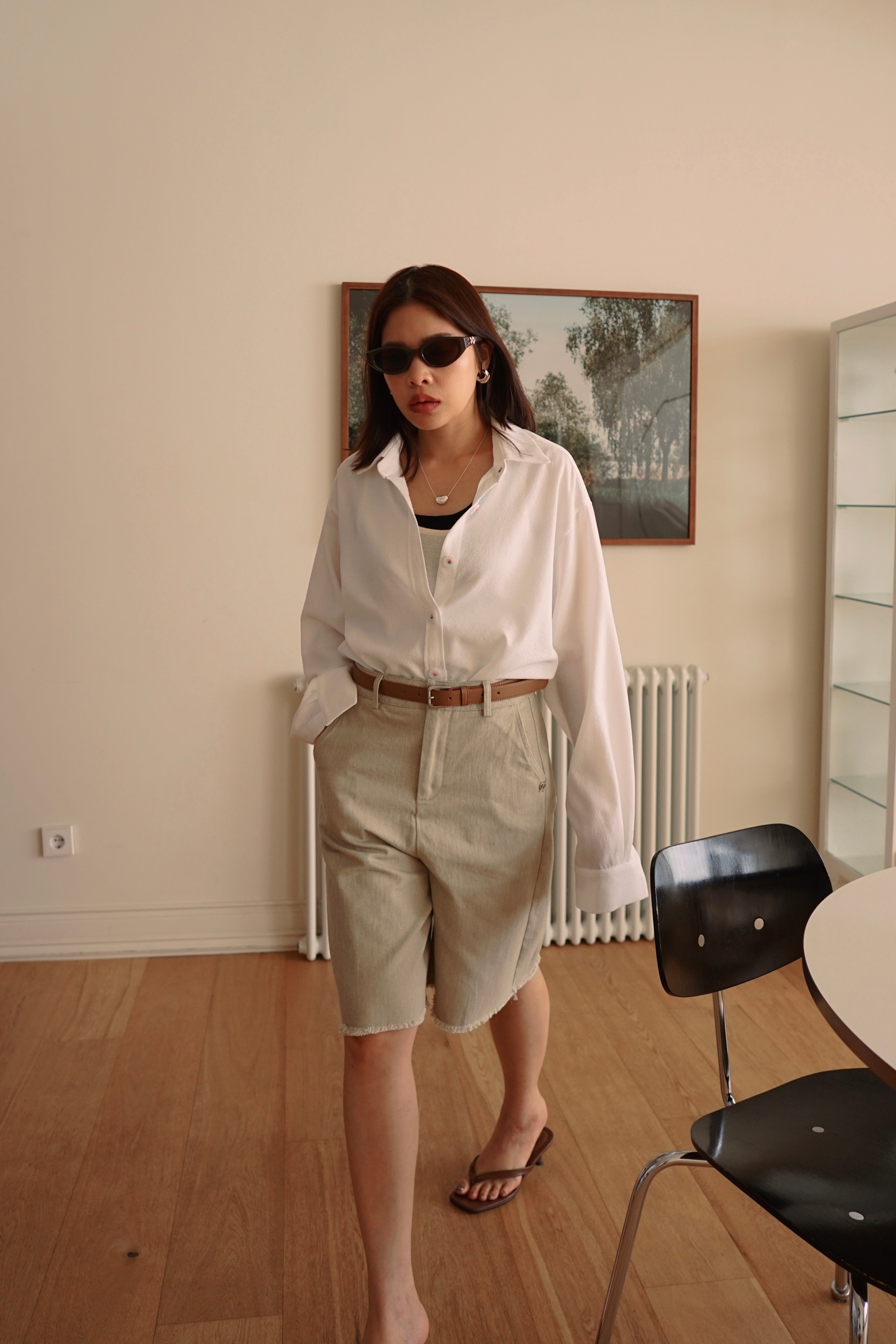 Relaxed fit denim bermuda shorts with frayed hem