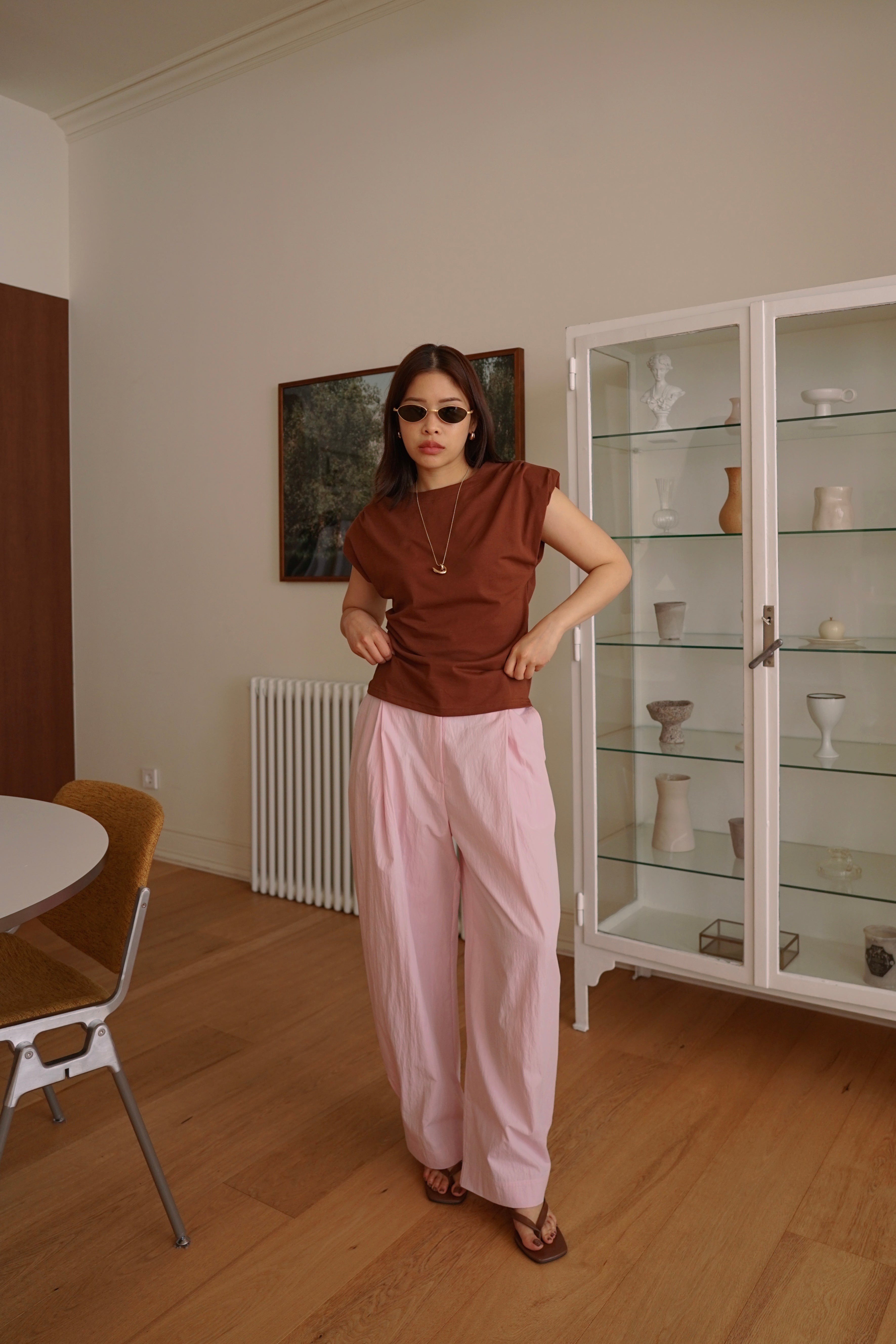 Pleated trousers with adjustable hem