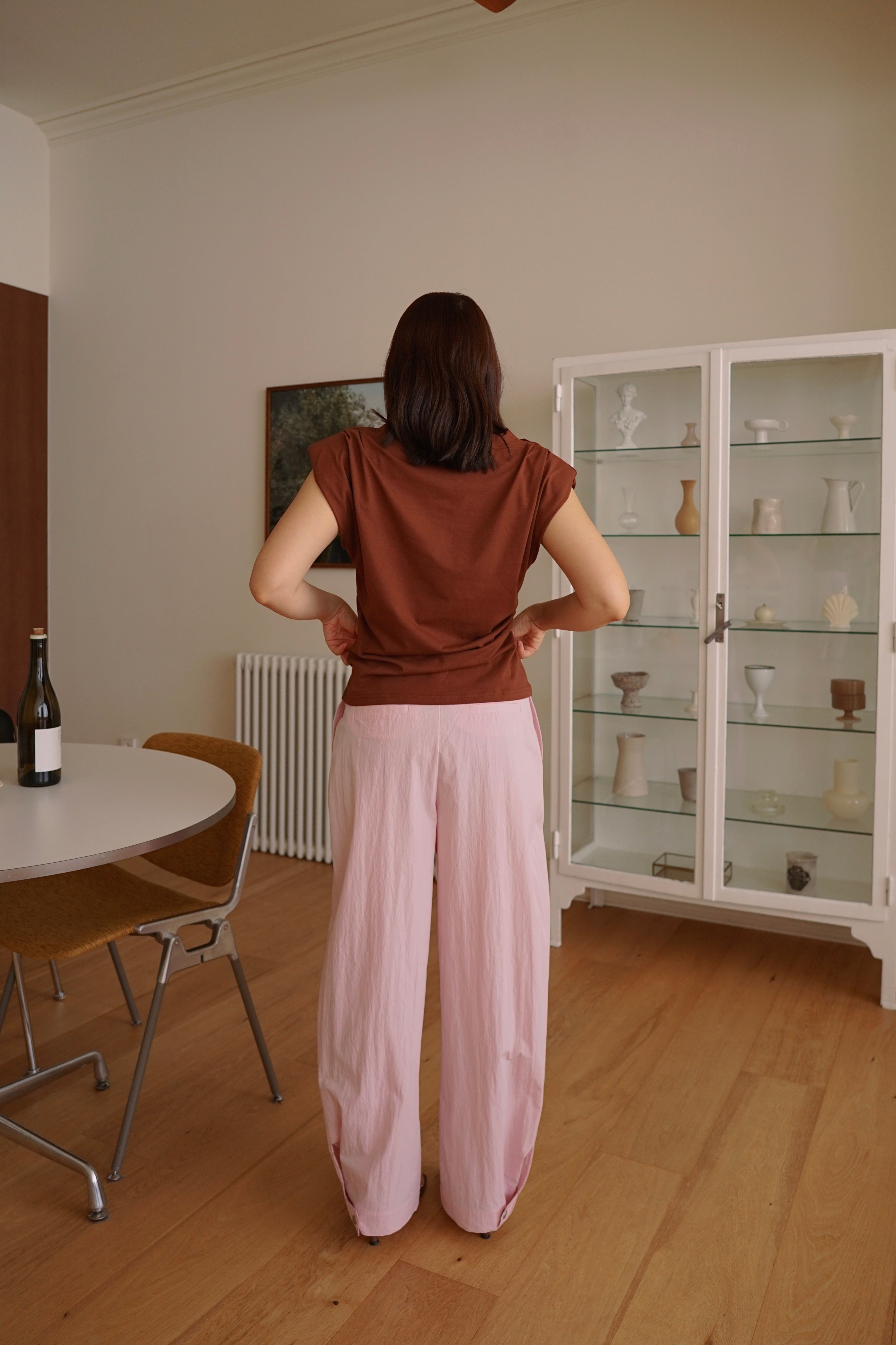 Pleated trousers with adjustable hem