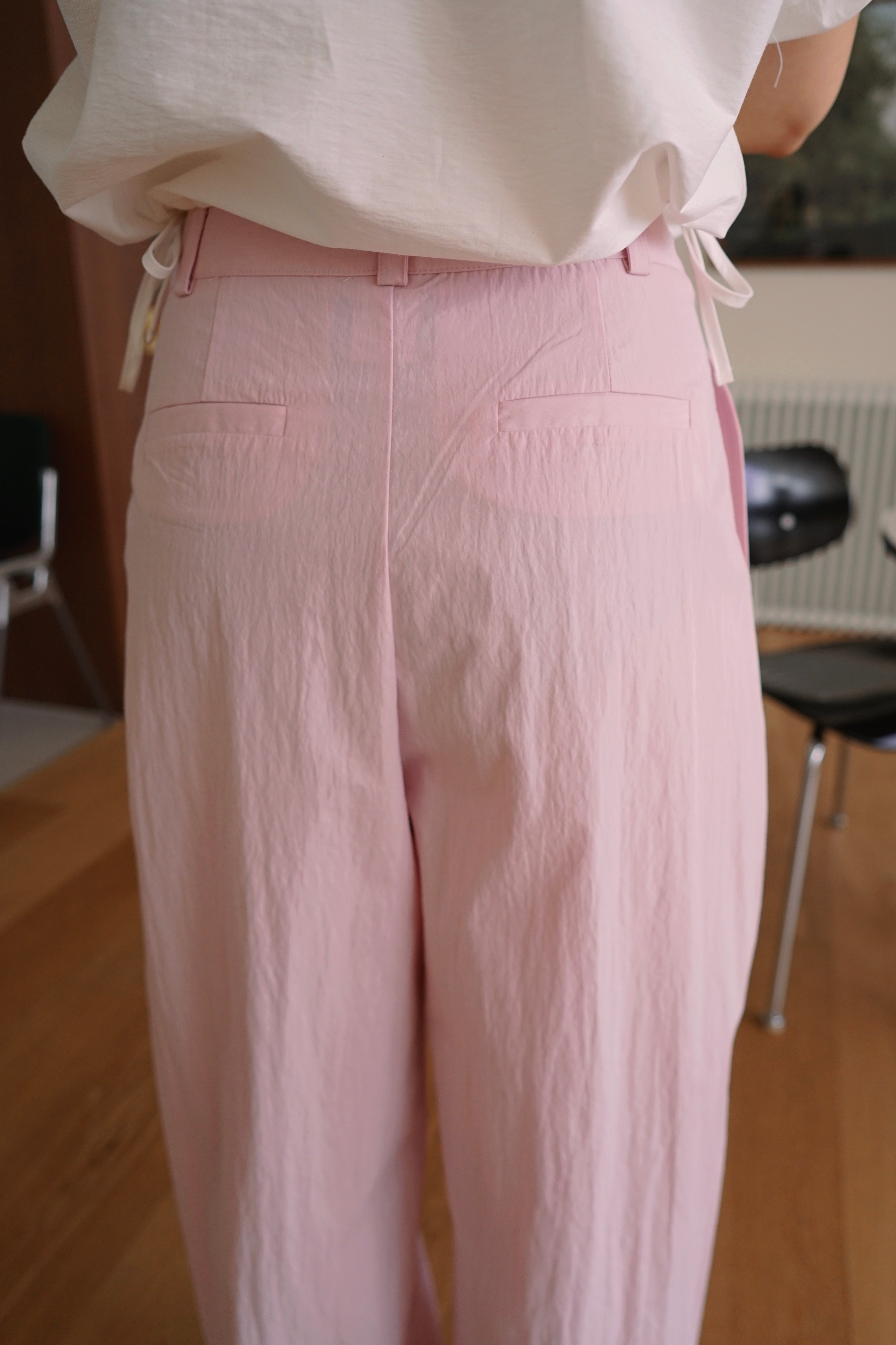 Pleated trousers with adjustable hem