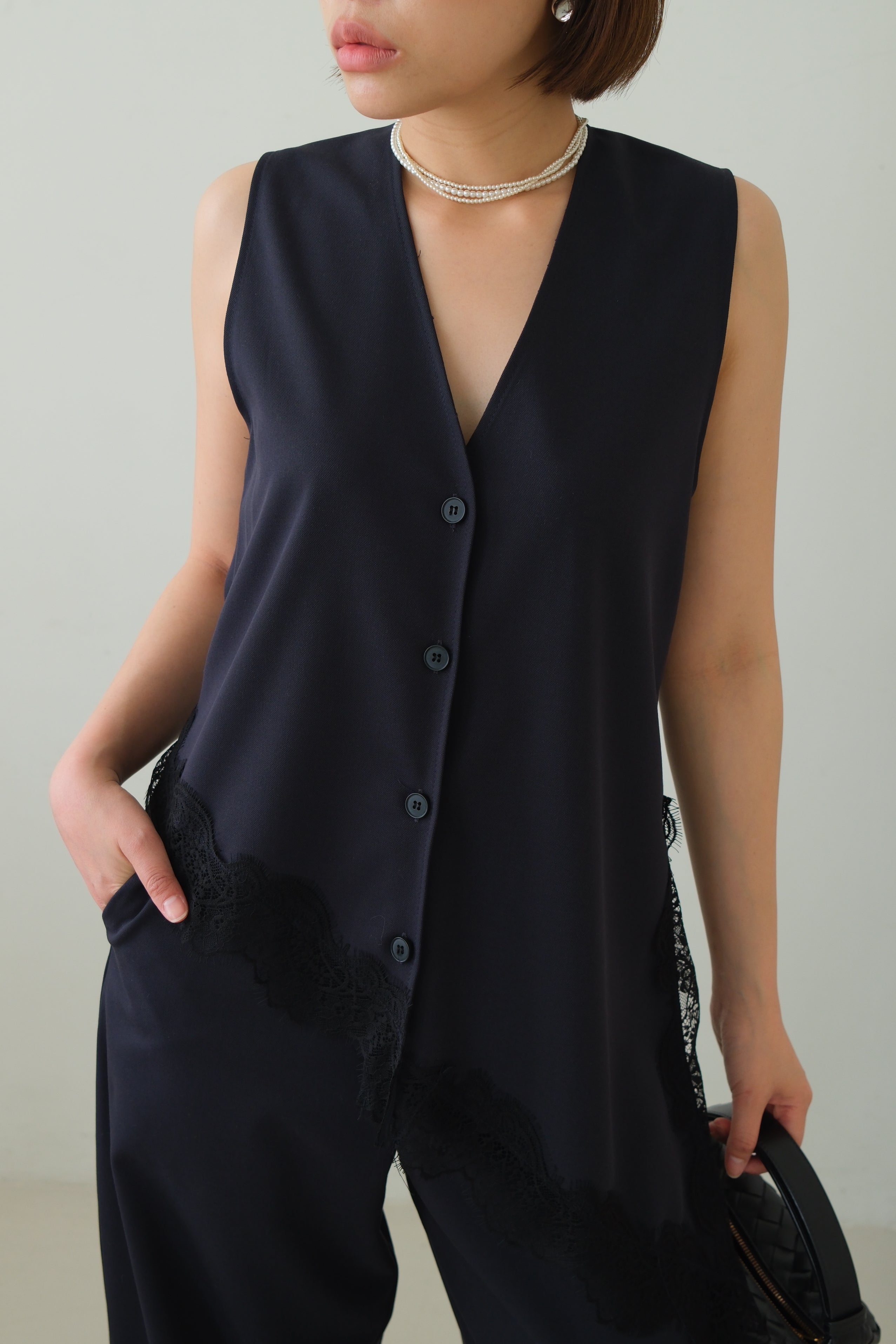 Norm Asymmetric V-Neck Lace Hem Vest