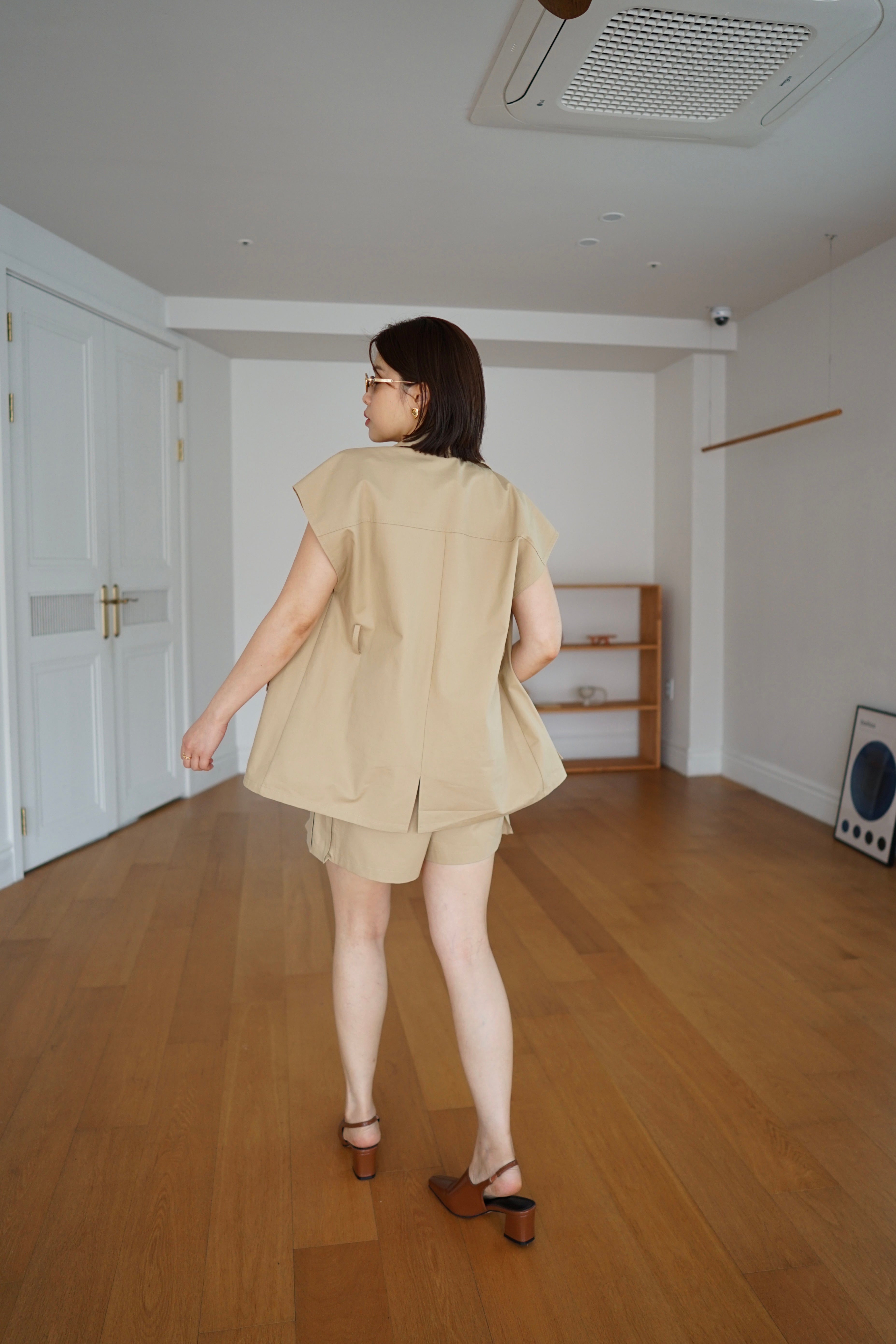 Roma sleeveless jacket with belt