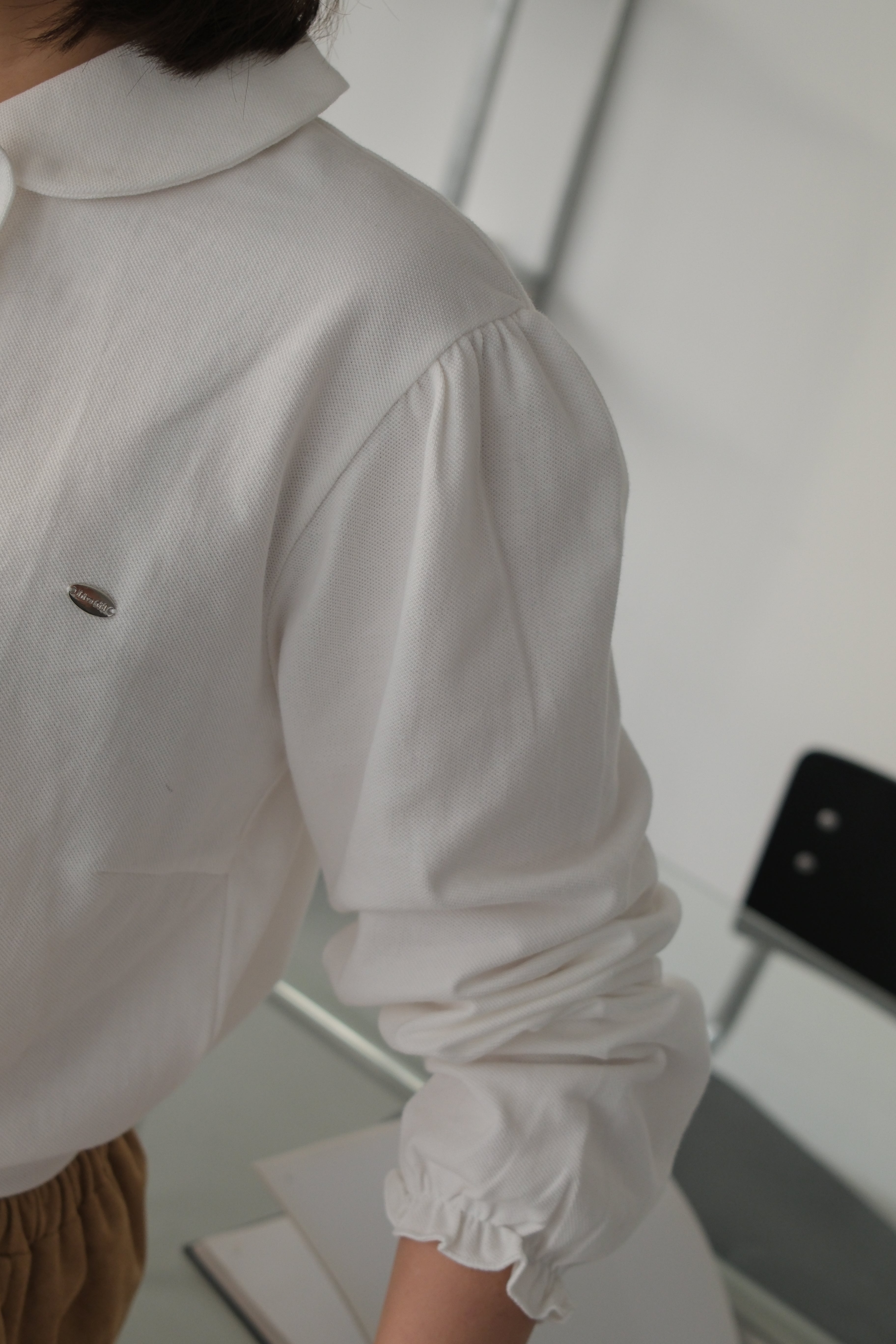 Nabi ruffle collar polo top